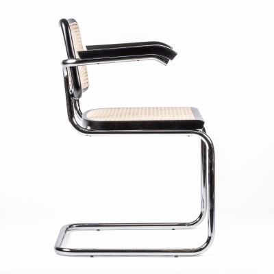 Replica of the Cesca Chair with armrests by designer Marcel Breuer