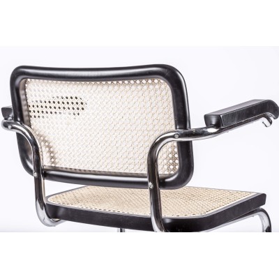 Replica of the Cesca Chair with armrests by designer Marcel Breuer